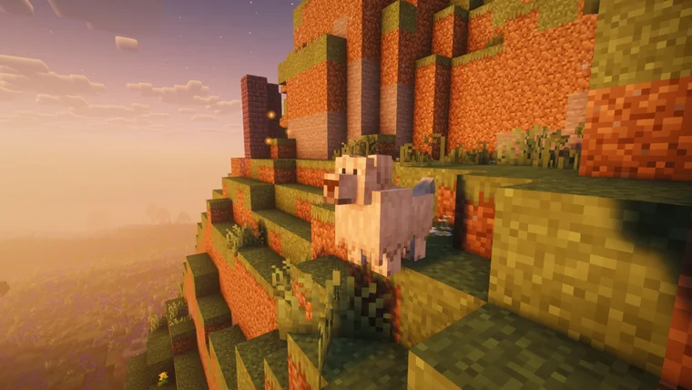 A pig on the orange terraces of a badlands canyon at sunset.