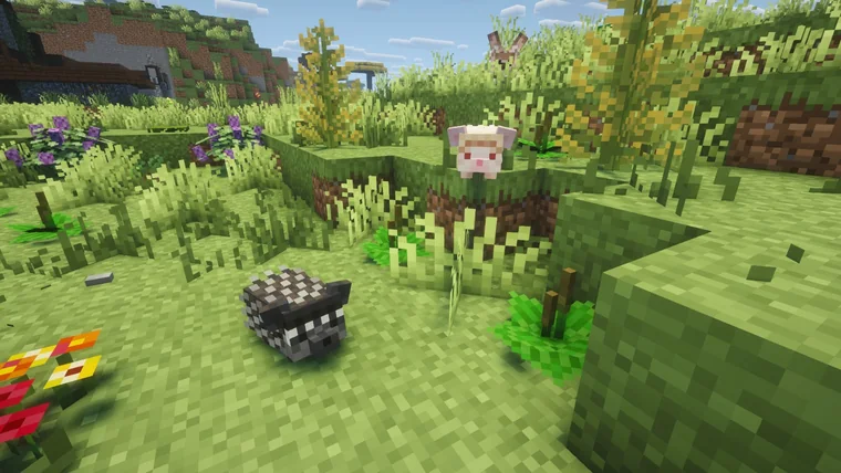 A small pink-eared rabbit-like creature and a gray hedgehog near a patch of purple flowers.