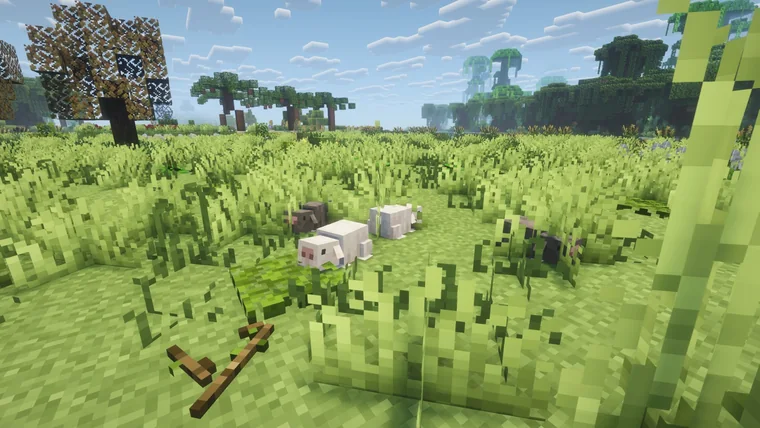 A small flock of white and black sheep in a grass field, with a floating jungle island in the distance.