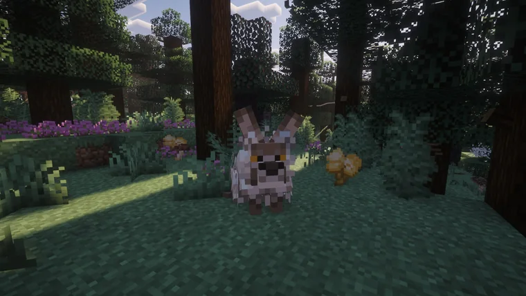 A white and brown goat-like creature standing in a dark forest among purple flowers.