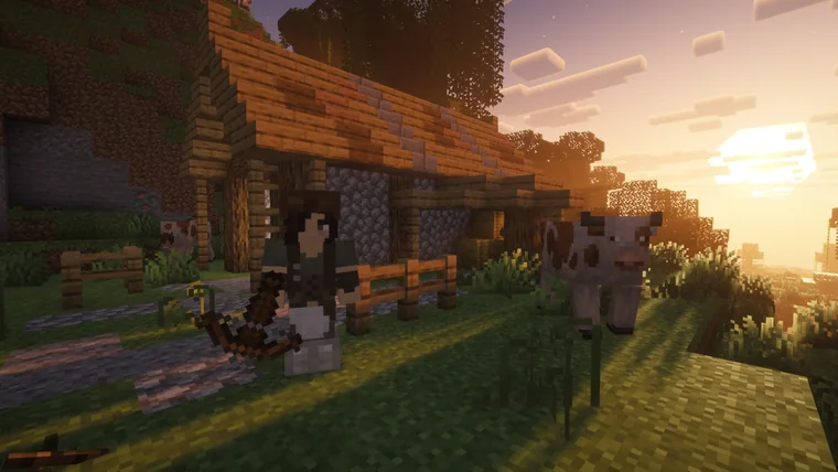 A player character beside a spotted cow at sunset by a wooden farmhouse.